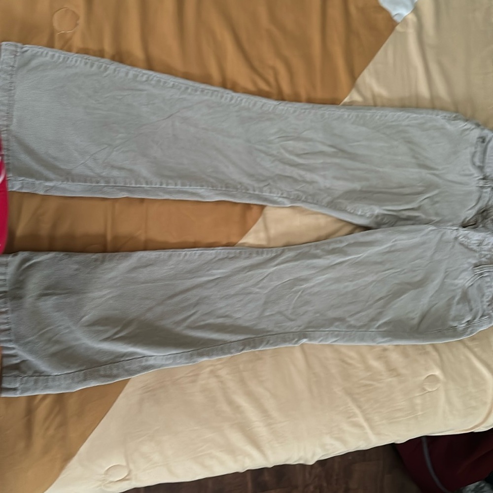 Low rise khaki colored flare jeans